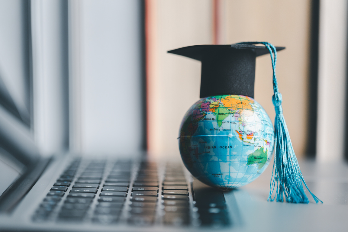 Graduation cap with Earth globe. Concept of global business study, abroad educational, Back to School. Education in Global world, Study abroad business in universities in worldwide. language study