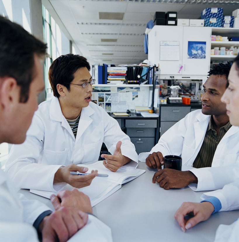 Group of research scientists meeting in research lab