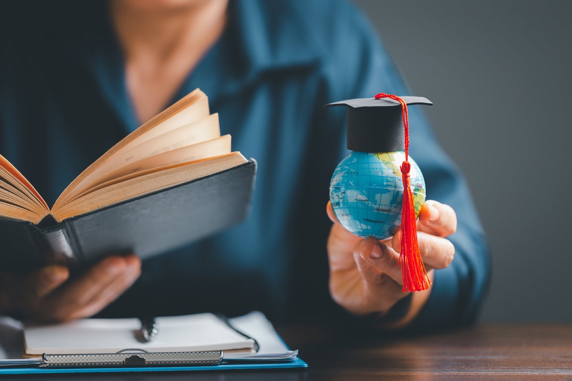 Graduation cap with Earth globe. Concept of global business study, abroad educational, Back to School. Education in Global world, Study abroad business in universities in worldwide. language study